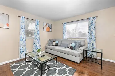 a living room with a couch and a table at Cozy 2 bedroom apartment in Dayton