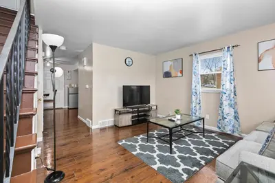 a living room with a couch and a tv at Cozy 2 bedroom apartment in Dayton
