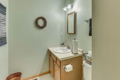 a bathroom with a sink and a toilet at 2 Mi to Woodbury Wildlife Area Cozy Farmhouse! in Warsaw