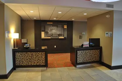 a lobby with two reception desks in a hotel at Holiday Inn Express Salem by IHG in Salem