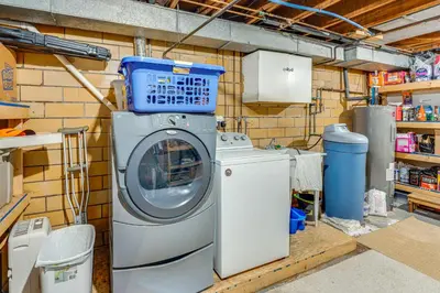 a washing machine with a box on top of it at 3 Mi to Pro Football Hall of Fame Home with Yard! in Canton