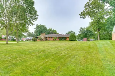 a large grassy field in front of a house at 3 Mi to Pro Football Hall of Fame Home with Yard! in Canton