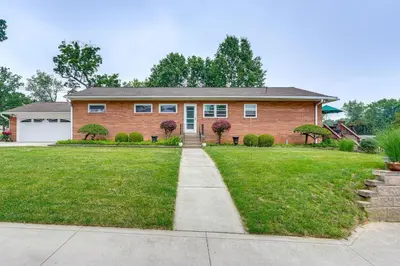 a brick house with a grass yard at 3 Mi to Pro Football Hall of Fame Home with Yard! in Canton