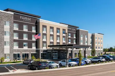 a hotel with cars parked in a parking lot at Fairfield Inn & Suites Dayton Beavercreek in Beavercreek
