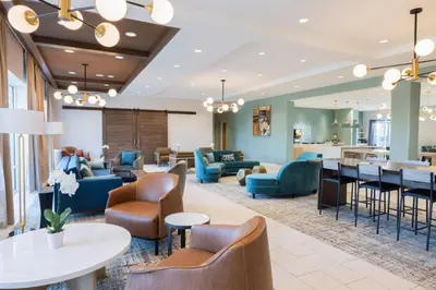 a lobby of a hotel with couches and chairs at Fairfield Inn & Suites Dayton Beavercreek in Beavercreek