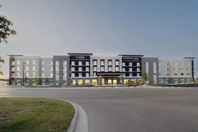 a large building with a parking lot in front of it at Fairfield Inn & Suites Dayton Beavercreek in Beavercreek