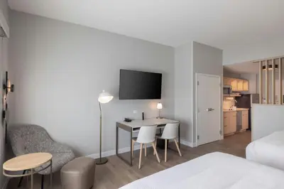 a bedroom with a desk and a table and chairs at TownePlace Suites Dayton Beavercreek in Beavercreek
