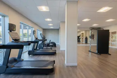 a gym with treadmills and ellipticals in a building at TownePlace Suites Dayton Beavercreek in Beavercreek