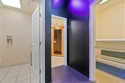 a walk in closet with purple walls and a door at 1Br in Heart of Downtown, Sauna, Prime Location in Cleveland