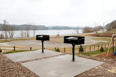 two lights on a sidewalk near a body of water at Amazing A-Frame by Tappan Lake Perfect for Outdoor Lovers in Ohio in Deersville