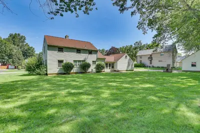 a house with a yard with green grass at 1 Mi to Dtwn Salem Apt with Garage Access! in Salem