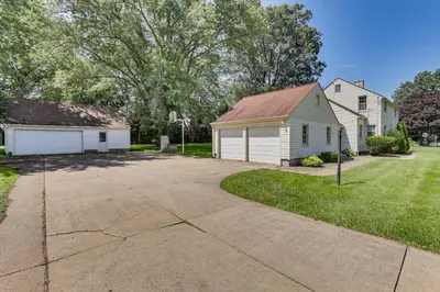 a house with a garage and a driveway at 1 Mi to Dtwn Salem Apt with Garage Access! in Salem