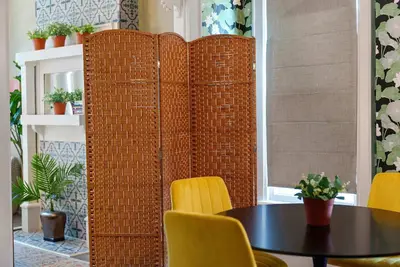 a room with a table and a wall of wicker at Merion Village Residences - Escape the Hustle & Bustle in Columbus