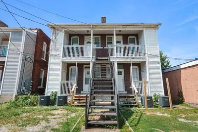 a house with a staircase in front of it at Merion Village Residences - Peaceful Columbus Neighborhood in Columbus
