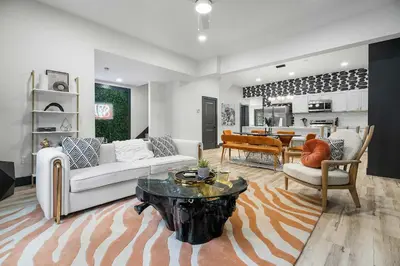 a living room with a couch and a table at The Dayton Dream house in Dayton