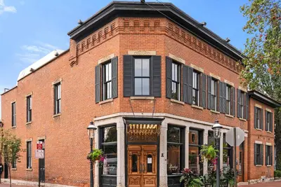 a red brick building with a store front at GV - Romantic Beach Getaway in Columbus