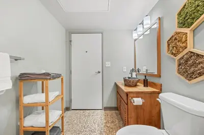 a bathroom with a sink and a toilet at 1 BD Apt l Downtown l Parking l Fast Wi-Fi l Café in Cleveland