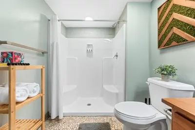 a bathroom with a toilet and a shower at Downtown Loft l Cleveland l Parking l Cafe in Cleveland
