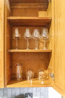 a row of wine glasses sitting on a shelf at Downtown Loft l Cleveland l Parking l Cafe in Cleveland