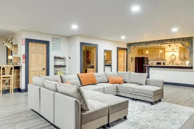 a living room with a couch and a kitchen at 6 Mi to Main Street Dog-Friendly Home in Dover! in Dover