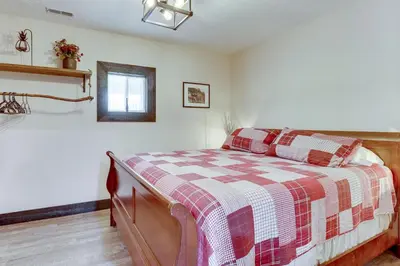 a bedroom with a bed with a checkered blanket at 6 Mi to Main Street Dog-Friendly Home in Dover! in Dover
