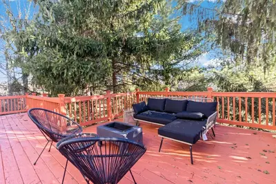 a patio with a couch and chairs on a deck at The Green Escape in Oakley 2 bed 1 bath in Cincinnati