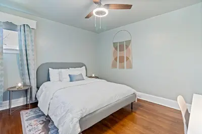 a bedroom with a bed and a ceiling fan at The Green Escape in Oakley 2 bed 1 bath in Cincinnati