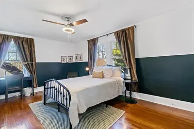 a bedroom with a bed and a ceiling fan at The Green Escape in Oakley 2 bed 1 bath in Cincinnati