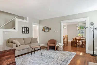 a living room with a couch and a table at Cozy Urban Farmhouse 3bd1andhalfbth in Cincinnati
