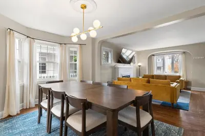 a dining room with a table and chairs and a couch at Inviting 4BR2BA in Oakley with 2 Park Spots & Lg Deck in Cincinnati