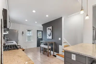 a kitchen with a table and a counter top at HydePark Abode Two 1st flr bedrms in Cincinnati