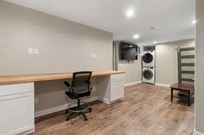 an empty living room with a desk and a chair at Newly renovated Spacious & Cozy 3Bd Home in Oakley in Cincinnati