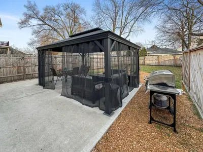 a black gazebo with a table and a grill at Newly renovated Spacious & Cozy 3Bd Home in Oakley in Cincinnati