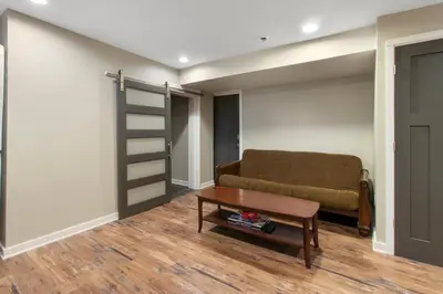 a living room with a couch and a table at Newly renovated Spacious & Cozy 3Bd Home in Oakley in Cincinnati