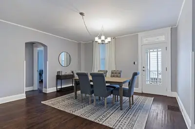 a dining room with a table and chairs at Walkable and Central with 1st flr bedroom and bathroom in Cincinnati