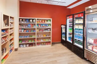 a grocery store aisle with shelves of food and drinks at Holiday Inn Express & Suites Sandusky by IHG in Sandusky