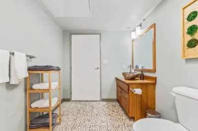 a bathroom with a sink and a mirror at Studio Apt In DT l Parking l Fast Wi-fi l Café in Cleveland