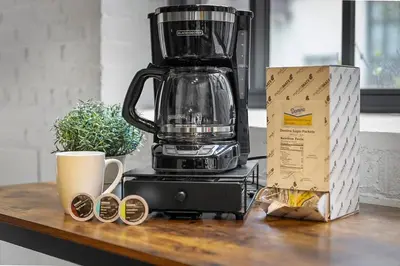 a coffee maker sitting on a counter next to a box at Brooklyn Style Loft l DT l Parking l Cafe in Cleveland