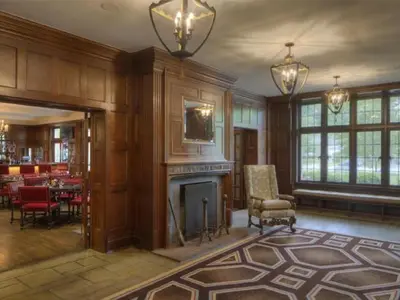 a living room with a fireplace and a dining room at Granville Inn in Granville