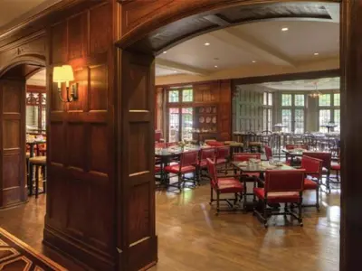 a dining room with tables and chairs in a restaurant at Granville Inn in Granville