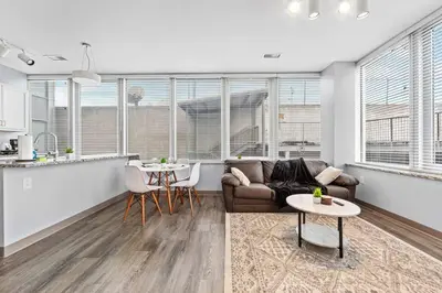 a living room with a couch and a table at Near DT & CLE Clinic Queen Bed Wi-Fi Parking in Cleveland