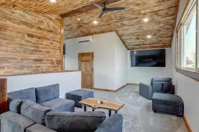 a living room with a couch and a table at Walk to Lake Erie Spacious Home in Sandusky! in Sandusky