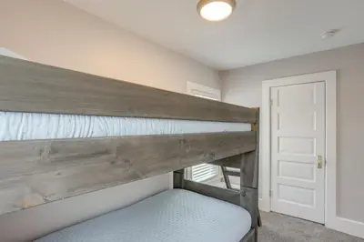 a bedroom with a bunk bed in a room at Walk to Lake Erie Spacious Home in Sandusky! in Sandusky
