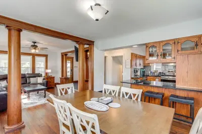 a kitchen and dining room with a table and chairs at Walk to Lake Erie Spacious Home in Sandusky! in Sandusky