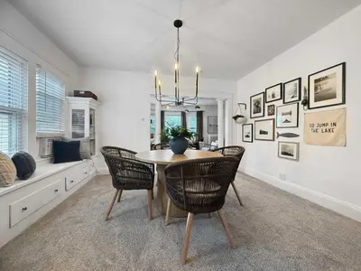 a dining room with a table and chairs at Chic Lakeside Retreat Steps from the Beach in Cleveland