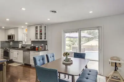 a kitchen and dining room with a table and chairs at Dayton Family Home with Game Room Walk to City Park in Dayton