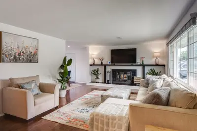 a living room with a couch and a fireplace at Dayton Family Home with Game Room Walk to City Park in Dayton