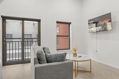 a living room with a couch and a table at Luxury Condo l DT l Playhouse Square l Sofa Bed in Cleveland