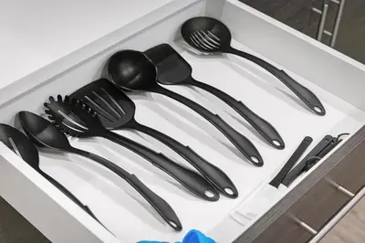 a drawer filled with black utensils in a box at Luxury Condo l DT l Playhouse Square l Sofa Bed in Cleveland