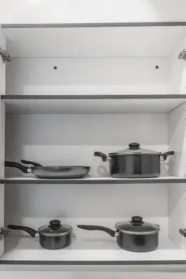 two pots and pans sitting on top of a stove at Luxury Condo l DT l Playhouse Square l Sofa Bed in Cleveland